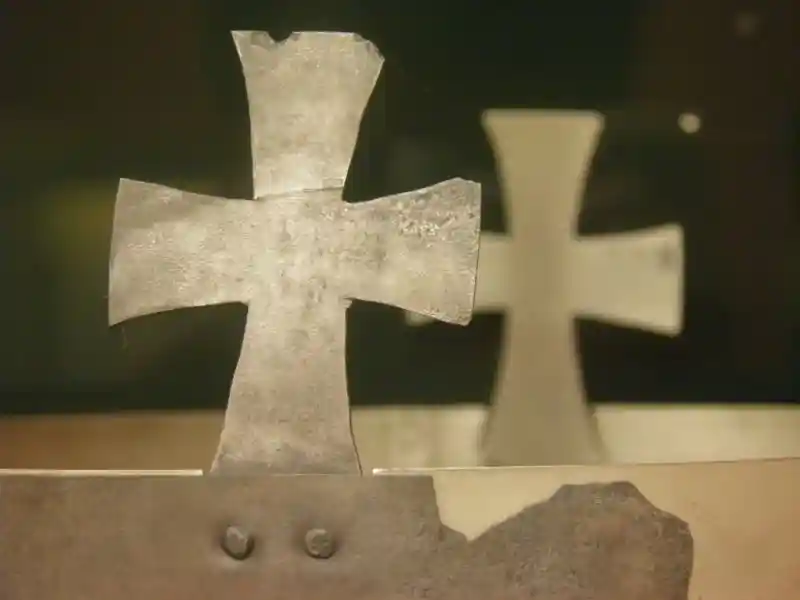 Cross on a metal crown
